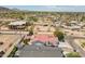 An aerial view showcasing a single-Gathering home with red tile roof in a suburban neighborhood at 2701 E Caldwell St, Phoenix, AZ 85042
