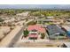 View of a home from above featuring a terracotta roof, fenced yard, and nearby residences at 2701 E Caldwell St, Phoenix, AZ 85042