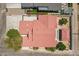 Aerial shot of a home featuring a terracotta-colored roof, trees, and a concrete driveway at 2701 E Caldwell St, Phoenix, AZ 85042