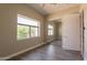 Bright bedroom with wood-look tile floors and natural light at 2701 E Caldwell St, Phoenix, AZ 85042