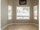Bright breakfast nook with large windows and neutral color palette, creating a cozy and inviting space at 2701 E Caldwell St, Phoenix, AZ 85042