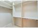 Walk-in closet with shelving and metal rods for organized storage at 2701 E Caldwell St, Phoenix, AZ 85042