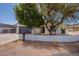 Inviting home showcasing a landscaped front yard and attached two car garage offering curb appeal at 2701 E Caldwell St, Phoenix, AZ 85042