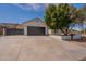 Well-maintained home boasting an attached two-car garage and landscaped yard enhancing its curb appeal at 2701 E Caldwell St, Phoenix, AZ 85042