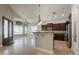 Spacious kitchen features dark wood cabinets, granite countertops and stainless steel appliances at 2701 E Caldwell St, Phoenix, AZ 85042
