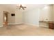 Cozy living room featuring a wet bar, mounted television, and convenient access to the bathroom and bedroom at 2701 E Caldwell St, Phoenix, AZ 85042