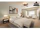 Large bedroom with a sitting area features a ceiling fan and a king size bed at 2701 E Caldwell St, Phoenix, AZ 85042