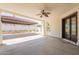 Spacious covered patio perfect for outdoor gatherings and relaxation with a ceiling fan at 2701 E Caldwell St, Phoenix, AZ 85042