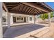 Covered patio with wooden roof and white pillars at 2701 E Caldwell St, Phoenix, AZ 85042