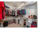 Walk-in closet with shelves and hanging racks for ample storage space at 3871 E Harrison St, Gilbert, AZ 85295
