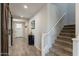 Stylish foyer featuring a barn door, tiled floors, and a staircase at 3871 E Harrison St, Gilbert, AZ 85295
