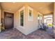 Inviting front porch with rocking chairs, neutral tones, and ample natural light at 3871 E Harrison St, Gilbert, AZ 85295