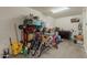 Garage with storage shelves, assorted bicycles, cleaning supplies, and other household items at 3871 E Harrison St, Gilbert, AZ 85295