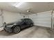 Clean garage featuring an overhead door and a late model Volvo SUV at 3871 E Harrison St, Gilbert, AZ 85295