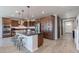 This home features a kitchen with an island, dark wood cabinets, and stainless steel appliances at 3871 E Harrison St, Gilbert, AZ 85295