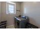 Neat laundry room featuring a laundry sign and side by side washer and dryer at 3871 E Harrison St, Gilbert, AZ 85295