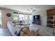 Inviting living room with a cozy fireplace, built-in cabinets, and large windows at 3871 E Harrison St, Gilbert, AZ 85295