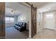 This home features a living room with a barn door, offering modern style and privacy at 3871 E Harrison St, Gilbert, AZ 85295