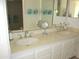 Bright bathroom featuring a double sink vanity with chrome faucets and ample cabinet space at 4303 E Cactus Rd # 413, Phoenix, AZ 85032