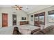 Comfortable bedroom with vaulted ceilings, French doors, and plush carpet offers a relaxing retreat at 4332 N Santiago Cir, Mesa, AZ 85215