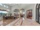 Expansive foyer boasts marble floors, arched doorways, and an elegant dining area, creating a grand entrance at 4332 N Santiago Cir, Mesa, AZ 85215
