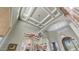 Stately foyer with coffered ceilings, chandelier, and arched doorways exudes luxury and sophistication throughout at 4332 N Santiago Cir, Mesa, AZ 85215