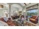 Open-concept living space includes a dining area, comfortable seating, and access to the backyard at 4332 N Santiago Cir, Mesa, AZ 85215