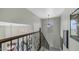 Upstairs landing offers a view of the neighborhood and showcases intricate railing details along the staircase at 4332 N Santiago Cir, Mesa, AZ 85215