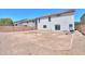 View of backyard with perimeter wall and home exterior at 43601 W Cowpath Rd, Maricopa, AZ 85138