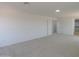 Spacious bedroom with neutral carpeting and walk-in closet at 43601 W Cowpath Rd, Maricopa, AZ 85138