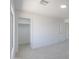 This bedroom features carpet, walk-in closet, and two white doors at 43601 W Cowpath Rd, Maricopa, AZ 85138