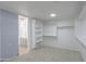 Well-lit walk-in closet with custom shelving and open space at 43601 W Cowpath Rd, Maricopa, AZ 85138