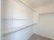 Organized walk-in closet featuring shelving and ample storage space at 43601 W Cowpath Rd, Maricopa, AZ 85138