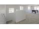 Spacious carpeted game room with a pool table and plenty of natural light at 43601 W Cowpath Rd, Maricopa, AZ 85138