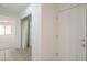 Bright hallway featuring a closet, tiled floor and natural light at 43601 W Cowpath Rd, Maricopa, AZ 85138