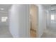 Hallway features two rooms and carpeted flooring throughout the house at 43601 W Cowpath Rd, Maricopa, AZ 85138