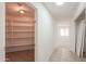 Pantry with multiple shelves for optimal storage at 43601 W Cowpath Rd, Maricopa, AZ 85138
