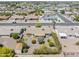 Aerial view of the home with a well-maintained backyard, featuring desert landscaping and mature trees at 6631 E Dallas St, Mesa, AZ 85205