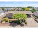 Aerial view of a well-maintained single-story home with mature trees and desert landscaping in a quiet neighborhood at 6631 E Dallas St, Mesa, AZ 85205