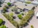 Overhead view of a landscaped backyard with mature trees, shaded patio, and low-maintenance desert landscape at 6631 E Dallas St, Mesa, AZ 85205