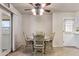 Charming dining room featuring a quaint round table, four chairs, and a stylish ceiling fan with lights at 6631 E Dallas St, Mesa, AZ 85205