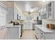 Bright kitchen featuring white cabinets, stainless steel appliances, and a tile floor at 6631 E Dallas St, Mesa, AZ 85205