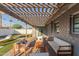 Inviting backyard features a pool, lounge chairs, an outdoor seating area under a pergola at 8522 E Virginia Ave, Scottsdale, AZ 85257