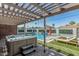 Luxurious backyard with pool, spa, covered patio, turf, and lounge seating, perfect for relaxing at 8522 E Virginia Ave, Scottsdale, AZ 85257