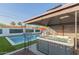 Inviting backyard features a pool, spa, lounge chairs, and an outdoor seating area at 8522 E Virginia Ave, Scottsdale, AZ 85257