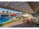 Inviting backyard features a pool, lounge chairs, an orange umbrella, and an outdoor seating area at 8522 E Virginia Ave, Scottsdale, AZ 85257