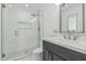 Stylish bathroom featuring a glass-enclosed shower with decorative tile, modern fixtures, and a sleek vanity at 8522 E Virginia Ave, Scottsdale, AZ 85257
