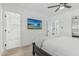 Bright bedroom featuring a TV, and an ensuite bathroom with glass shower doors, and modern design at 8522 E Virginia Ave, Scottsdale, AZ 85257