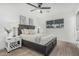 Cozy bedroom features a ceiling fan, neutral decor, and natural light from a window with wooden-style blinds at 8522 E Virginia Ave, Scottsdale, AZ 85257