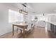 Beautifully lit dining room with a modern chandelier is open to the kitchen and living areas at 8522 E Virginia Ave, Scottsdale, AZ 85257